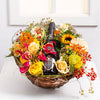 Basket with seasonal flowers and a wine for Easter wishes!