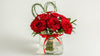 Bouquet of 10 red roses and a green heart (without the vase).