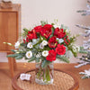 Christmas Arrangement of Flowers in a Vase