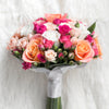 Wedding composition with roses in pale shades, buds and large, with special packaging for the occasion.